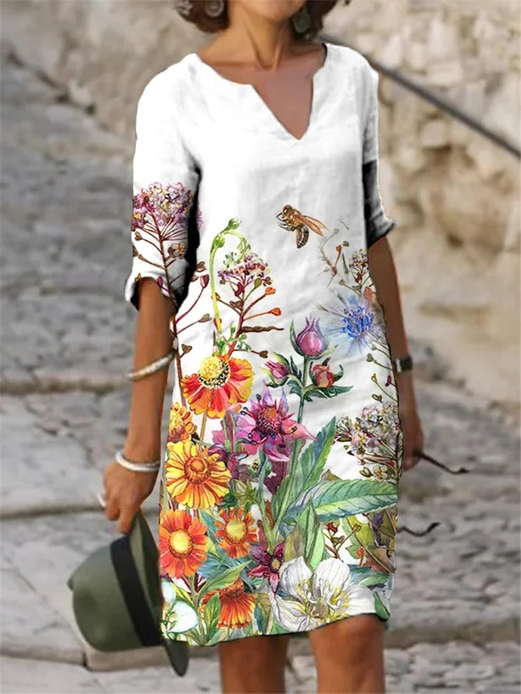 Vestido feminino de algodão com estampa floral colorida.