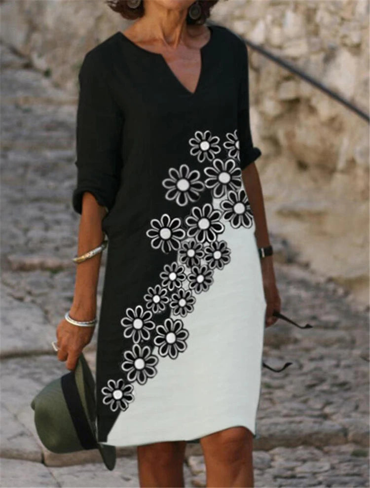 Vestido feminino de algodão com estampa floral colorida.